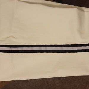White pants with Black double striping along side